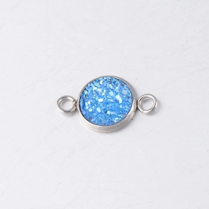 Close-up of blue drusy stone connector with double loops in stainless steel for DIY jewelry