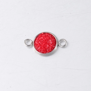 Detail view of a 10mm round red druzy stone connector in a silver stainless steel setting