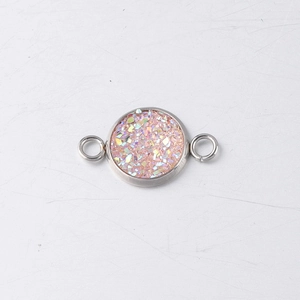 Macro view of 10mm stainless steel drusy connector with pink glitter for DIY jewelry