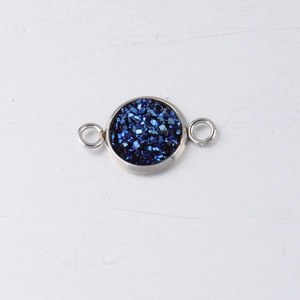 Macro detail of 10mm stainless steel drusy connector with sparkling dark blue crystal inlay