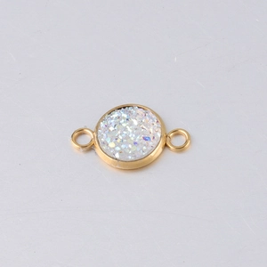 Detail view of a 10mm gold stainless steel starry pendant base with two side loops