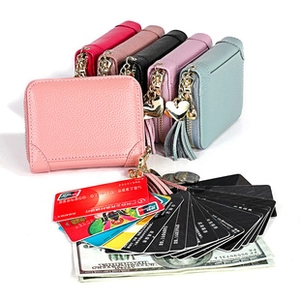 Detail of short leather wallet with heart pendant and multi-slot card holder