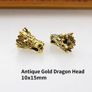 Detail view of ancient gold dragon head beads for DIY jewelry with 10x15mm dimensions