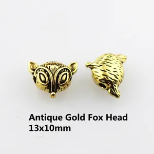 Antique gold fox head bead 13x10mm for DIY jewelry making showing vintage texture