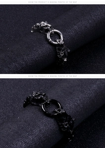 Detail of gothic stainless steel lion head bracelet with intricate engraved textures