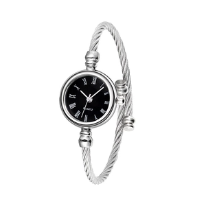 Detail of silver bangle watch with black Roman numeral dial and steel wire band
