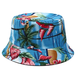 Detail of reversible sun hat featuring tropical flamingo and palm leaf prints