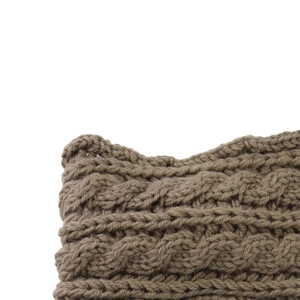 Close-up of brown cable-knit headband showing thick wool yarn texture and detailed stitching
