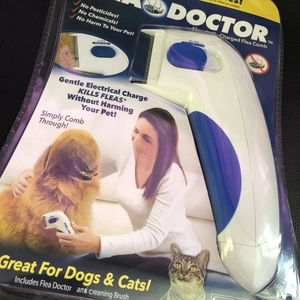Detailed retail packaging of the Flea Doctor electronic pet comb for dogs and cats