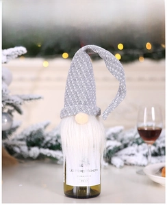Close-up of Nordic Gnome wine bottle cover with grey knitted hat and long white beard