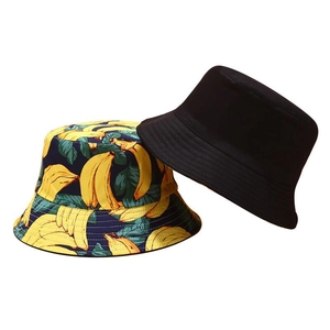 Women's sun protection bucket hats in solid black and yellow banana print patterns