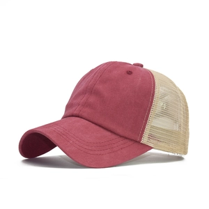 Vintage burgundy washed cotton mesh trucker hat shown from a 45-degree angle view