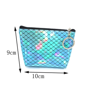 Detail view of iridescent blue fish scale wallet showing dimensions 9cm by 10cm