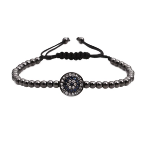Adjustable evil eye braided bracelet with dark grey metal beads and pave blue zircon