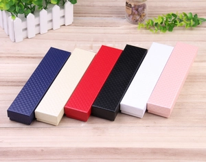 Detail showing long rectangular jewelry gift boxes with textured diamond patterns