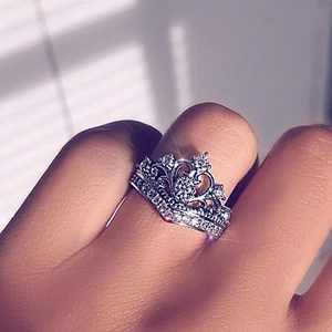 Macro view of silver crown ring with heart-shaped hollow design and cubic zirconia