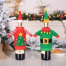 Christmas wine bottle covers in Santa and Elf designs on a festive decorated table