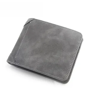 Detail of grey matte leather men's wallet featuring fine stitching and brand logo