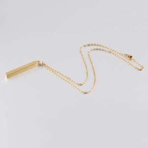 Minimalist gold bar pendant necklace with brushed steel finish on a thin cable chain