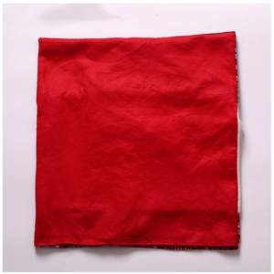 Close-up of red Christmas chair cover with snowflake pattern and festive fabric texture