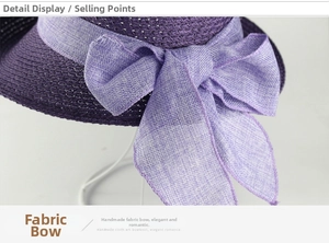 Detailed close-up of a light purple linen bow on a woven straw sun hat for women