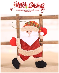 Detail of Santa Claus fabric ornament with red linen texture and plaid hat for Christmas trees