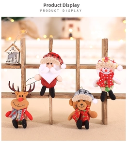 Close-up of four Christmas plush ornaments featuring Santa, snowman, bear and reindeer