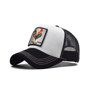 Detailed side view of black and white trucker hat with embroidered rooster patch