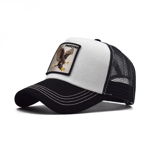 Macro view of Freedom eagle embroidered patch on a mesh trucker hat with contrast stitching