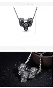 Detail view of gothic three-headed skull pendant with 30mm height and 17g weight specs