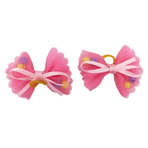 Close-up of pink mesh bow pet hair clips with colorful beads and elastic bands