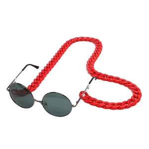 Retro round sunglasses with bright red acrylic chunky chain strap on white background