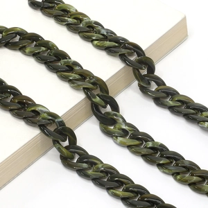 Detail of dark green marble acrylic chain link with smooth resin texture and polished finish