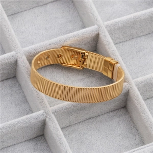 Detail of 10mm gold mesh stainless steel watch strap bracelet with buckle on velvet tray