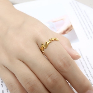 Elegant gold-plated Mama letter ring for women on a minimalist white background