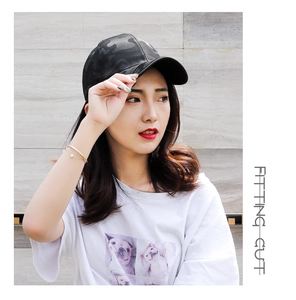 Detail of breathable camouflage baseball cap with textured mesh and curved brim design