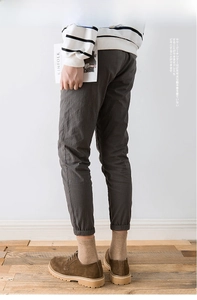 Deep grey men's jogger pants with elastic cuffs in a minimalist casual style