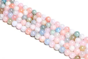 Macro shot of 8-10mm natural multi-color Morganite beads with smooth polished finish