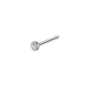 Macro view of silver stainless steel nose stud featuring a clear round zircon stone