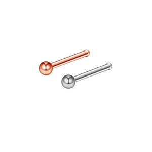 Detail view of silver and rose gold stainless steel ball end nose studs jewelry