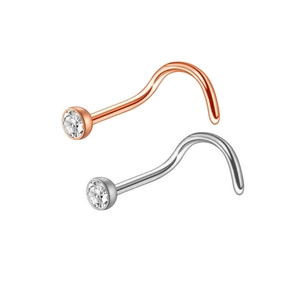 Detail of rose gold and silver stainless steel nose hoops with clear zircon stones