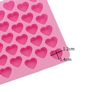 Detailed view of 55-cavity pink heart silicone mold with 1.4cm and 1.2cm size markings