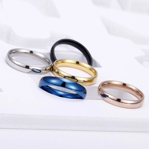 Set of five polished minimalist band rings in silver, black, gold, blue, and rose gold
