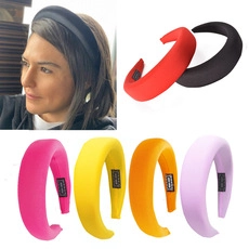 Detail view of thickened sponge headbands in various colors for a high-crown hairstyle