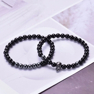 Set di bracciali in agata nera e ematite con ciondolo a teschio in metallo scuro
