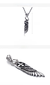 Detailed macro view of silver Gothic punk wings cross pendant with size measurements