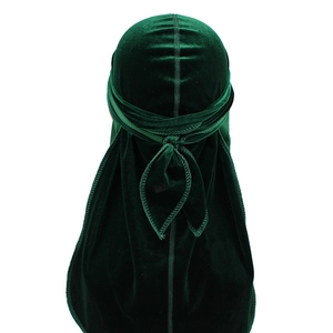 Detailed back view of dark green velvet durag showing long straps and premium texture