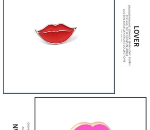 Detail view of red enamel lip brooch with silver metal trim on minimalist background
