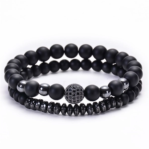 Close-up of matte black natural stone beads and micro-pave zircon ball stretch bracelets