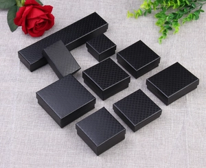 Set of black diamond pattern jewelry gift boxes in various sizes with textured surface